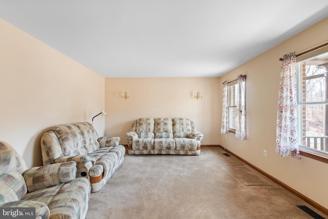 carpeted living room featuring a wealth of natural light