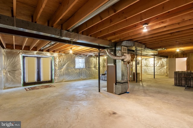 basement featuring heating unit