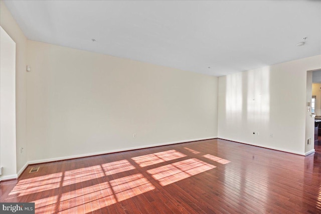 empty room featuring hardwood / wood-style flooring