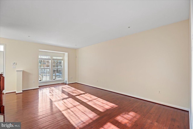 empty room featuring wood-type flooring