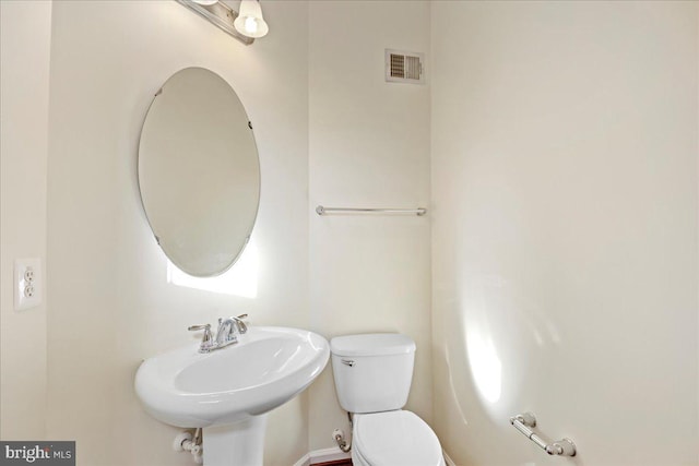 bathroom with sink and toilet