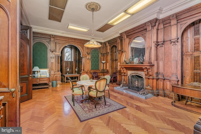 dining room with crown molding and light parquet flooring