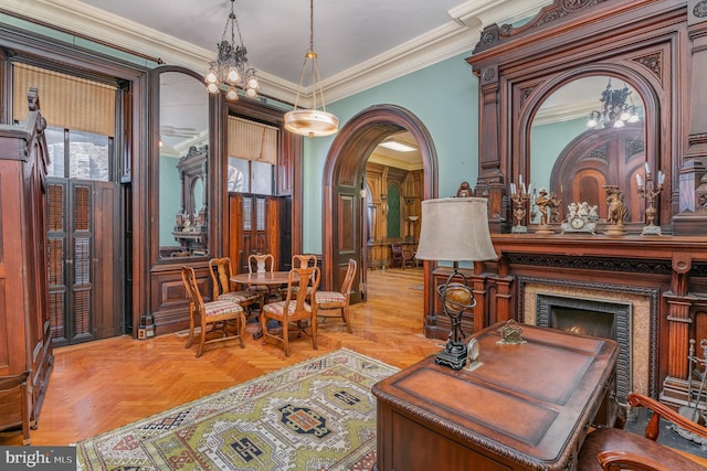 sitting room featuring light parquet flooring and crown molding