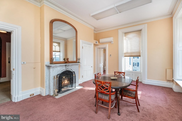 dining space with a fireplace, ornamental molding, an AC wall unit, and carpet flooring