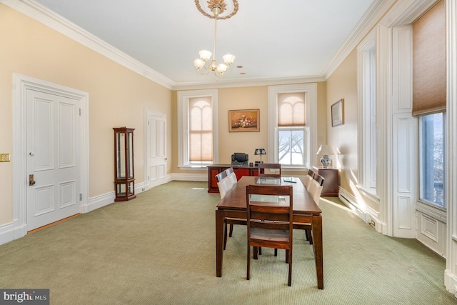 dining area with crown molding, light carpet, and an inviting chandelier