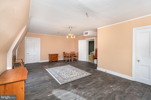 unfurnished room with crown molding, dark hardwood / wood-style flooring, and a chandelier