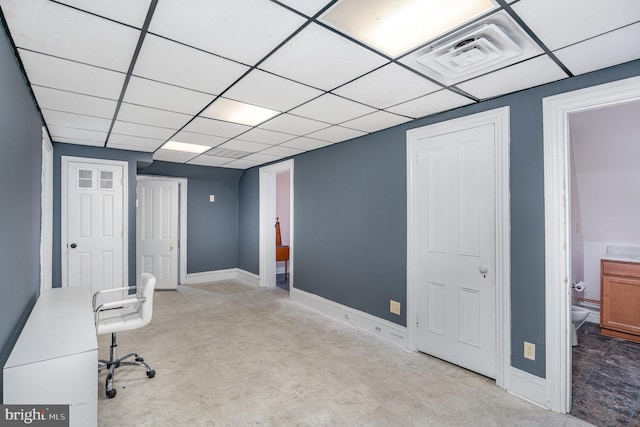 office with a paneled ceiling