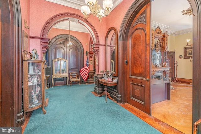 interior space featuring ornamental molding, parquet floors, and an inviting chandelier