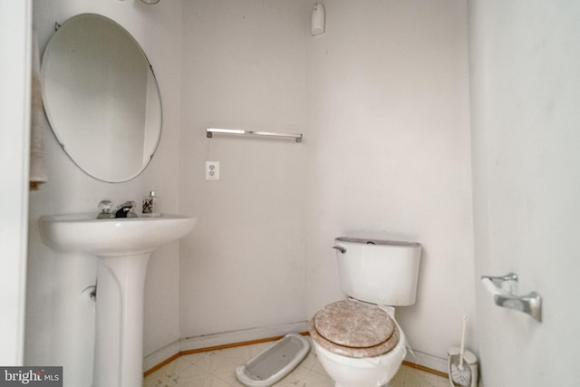 bathroom featuring toilet