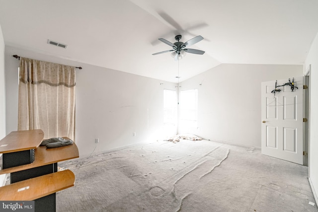 interior space with vaulted ceiling, carpet floors, and ceiling fan