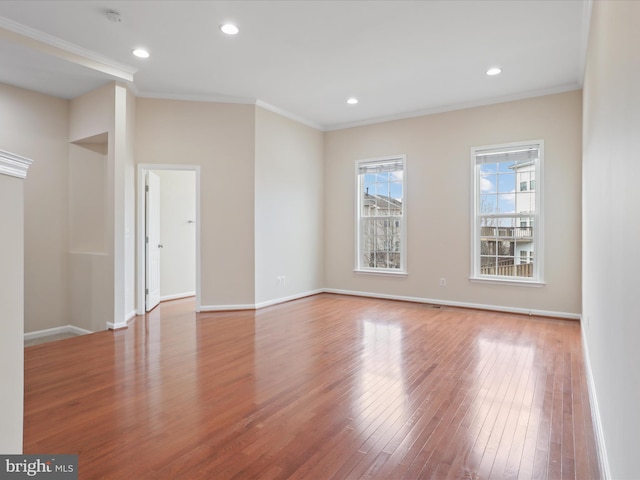 spare room with light hardwood / wood-style flooring and ornamental molding