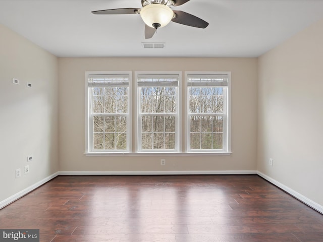 unfurnished room featuring dark hardwood / wood-style flooring and ceiling fan