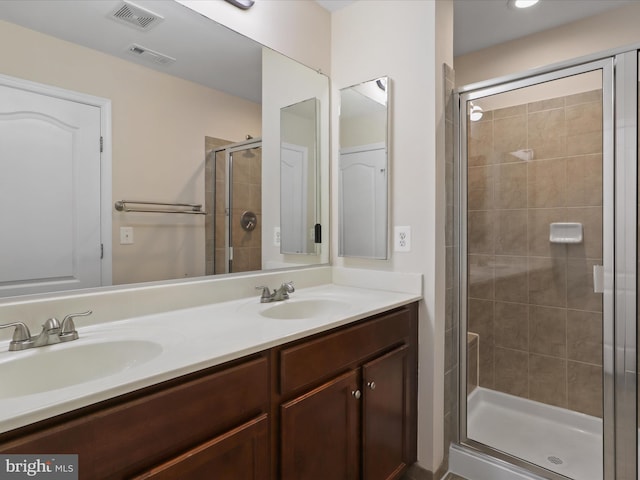 bathroom with vanity and an enclosed shower