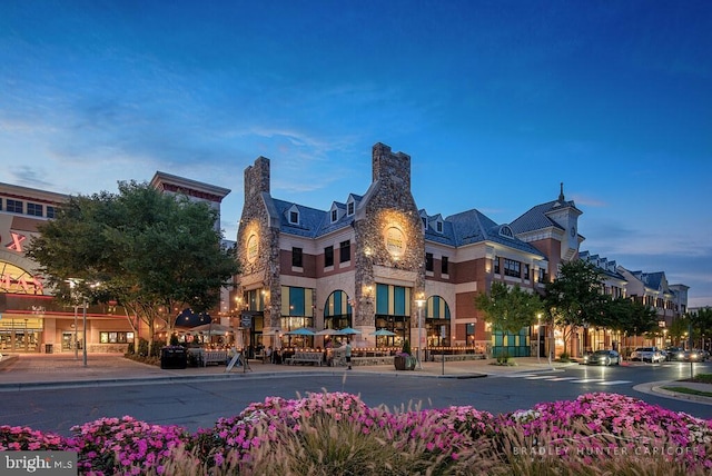 view of outdoor building at dusk