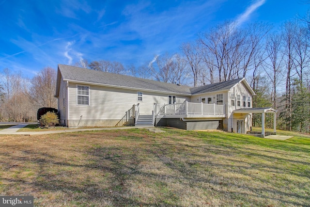 exterior space with a wooden deck and a yard