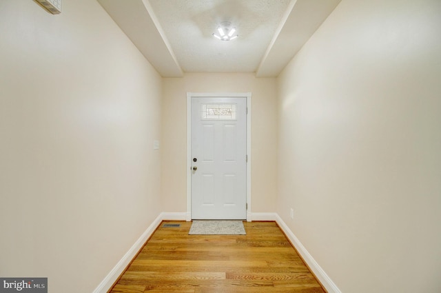 doorway to outside with light hardwood / wood-style flooring