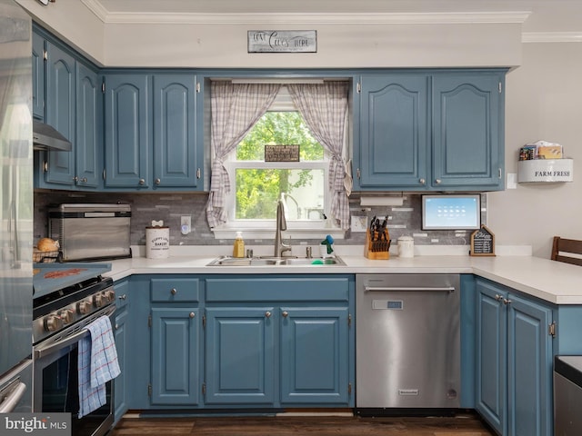 kitchen featuring blue cabinets, sink, crown molding, appliances with stainless steel finishes, and backsplash