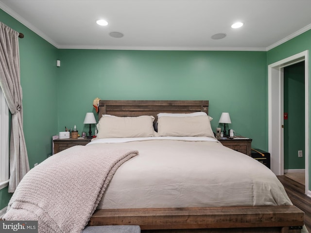 bedroom featuring hardwood / wood-style flooring and ornamental molding