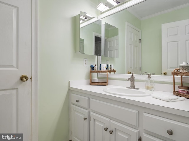 bathroom with vanity and crown molding