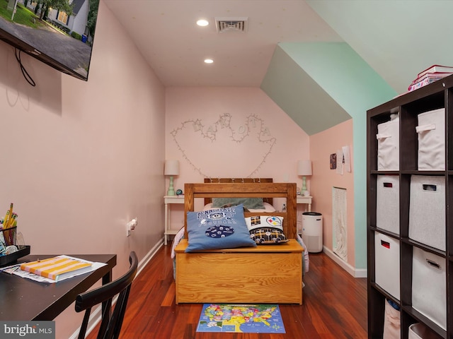 bedroom with dark hardwood / wood-style floors