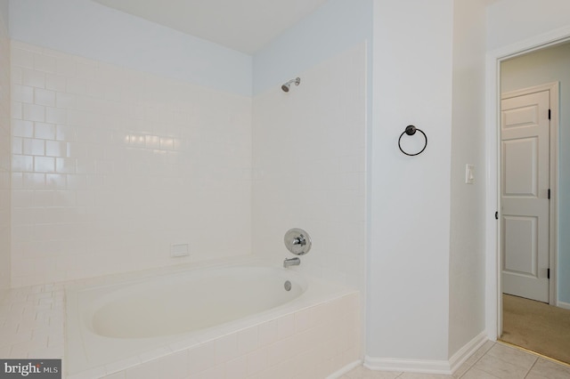 full bathroom featuring shower / tub combination, baseboards, and tile patterned floors