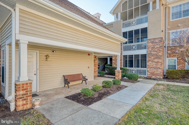 entrance to property with brick siding