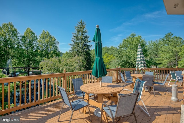 wooden deck with outdoor dining area