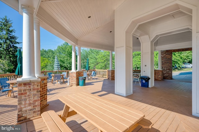 wooden deck with outdoor dining space