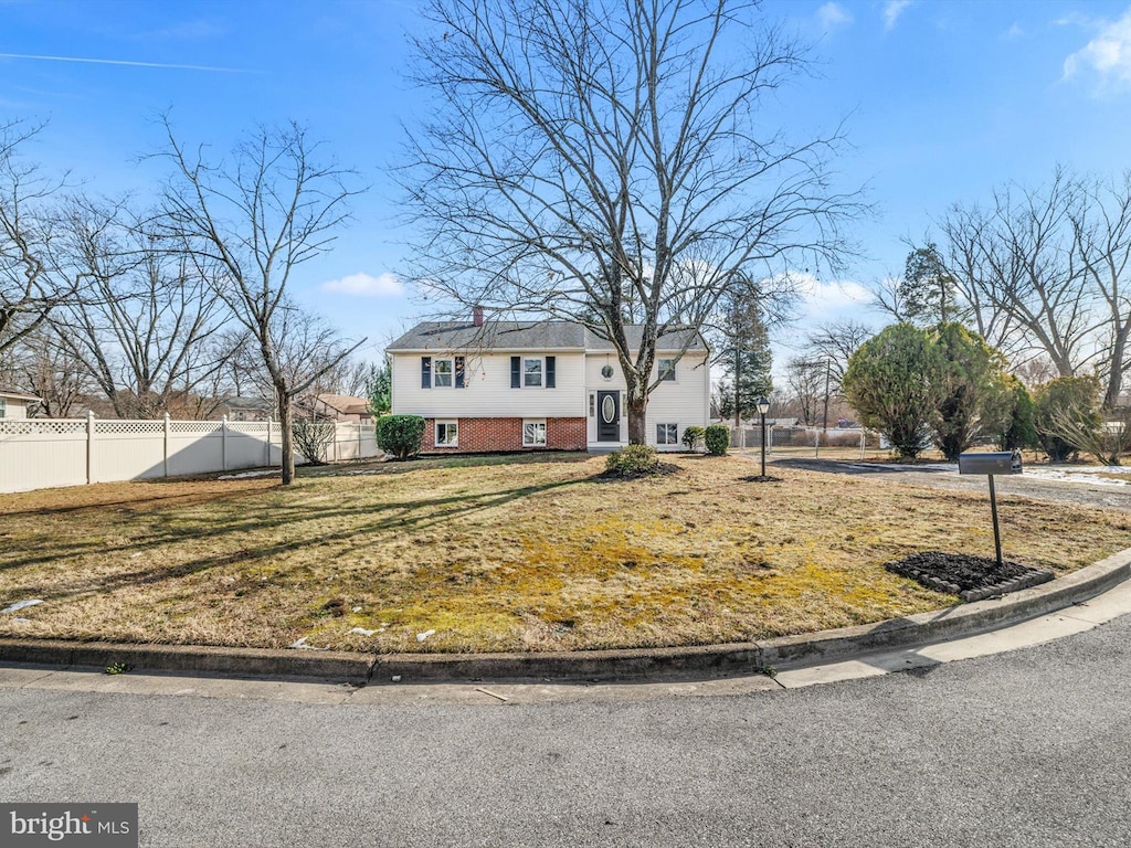 bi-level home with a front yard