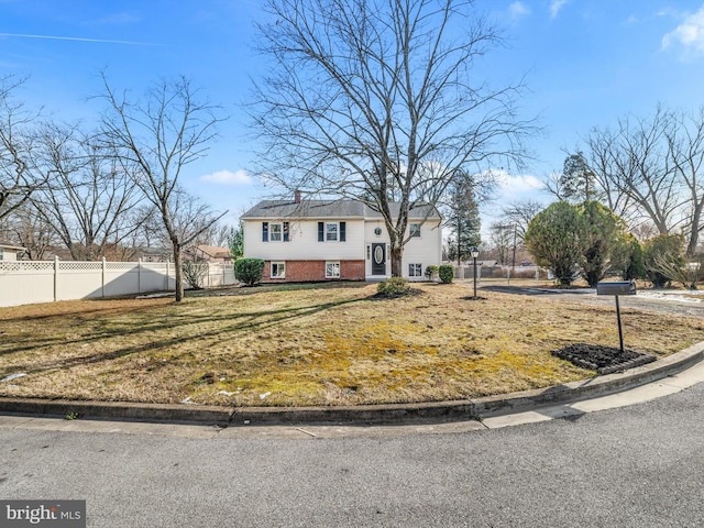 bi-level home with a front yard