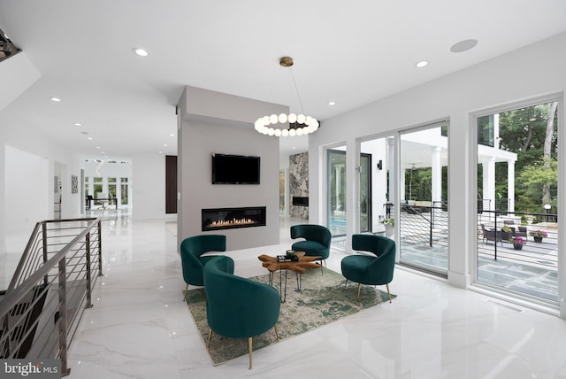 living room featuring an inviting chandelier