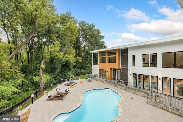 view of swimming pool with a patio