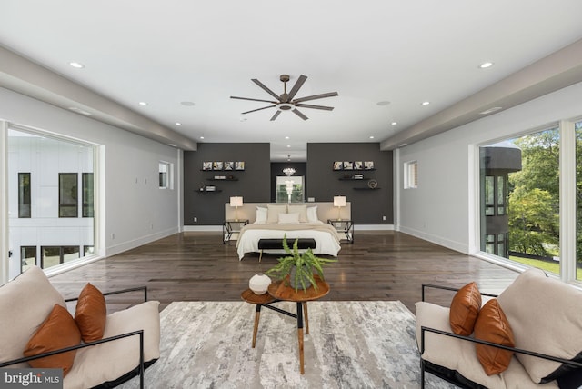 living room with ceiling fan and dark hardwood / wood-style floors