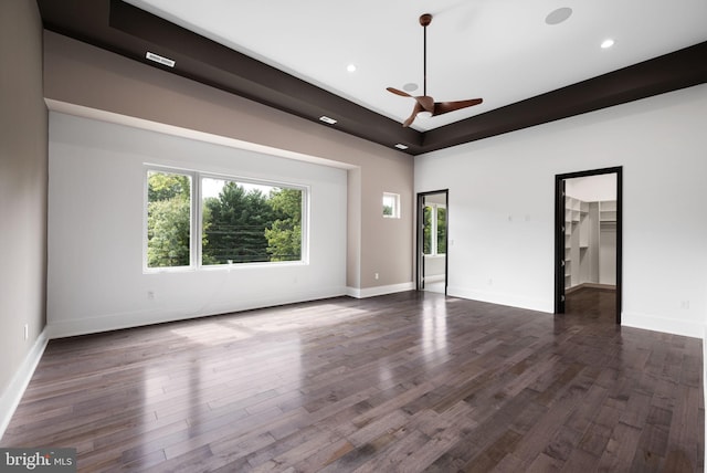 empty room featuring dark hardwood / wood-style floors and ceiling fan