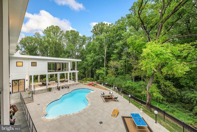 view of swimming pool with a patio