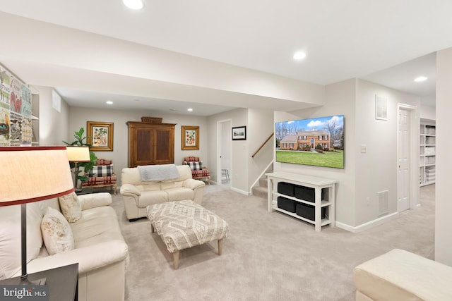 living area featuring recessed lighting, stairway, visible vents, baseboards, and light carpet