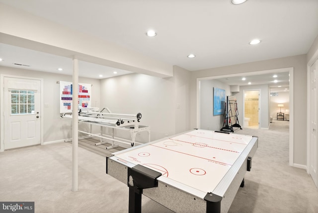 recreation room with baseboards, visible vents, recessed lighting, and light carpet