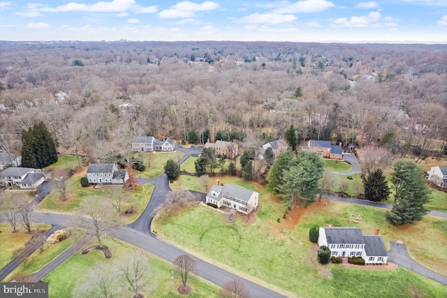 aerial view with a residential view and a wooded view