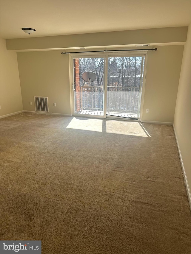 empty room featuring carpet flooring