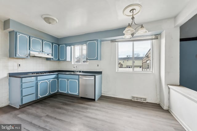 kitchen with pendant lighting, stainless steel dishwasher, light hardwood / wood-style floors, and sink