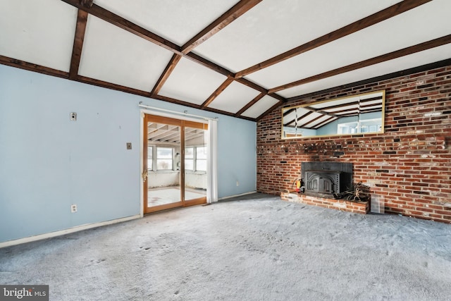 unfurnished living room featuring brick wall, lofted ceiling with beams, carpet, and a wood stove