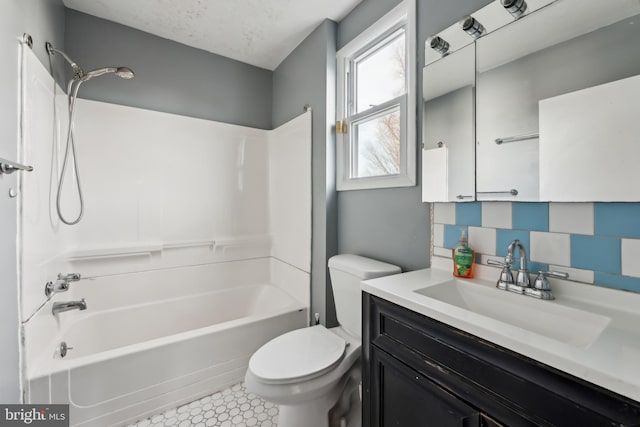 full bathroom featuring toilet, vanity, bathtub / shower combination, and tile patterned flooring