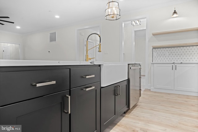 bathroom featuring hardwood / wood-style flooring and crown molding