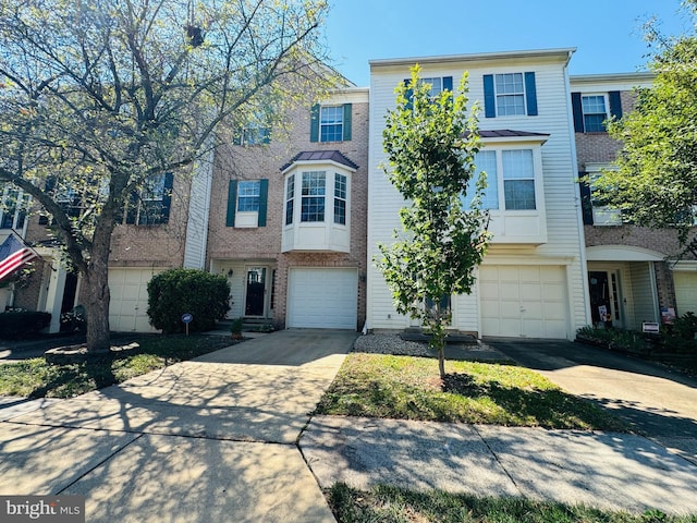 multi unit property featuring a garage