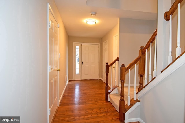 doorway with hardwood / wood-style flooring