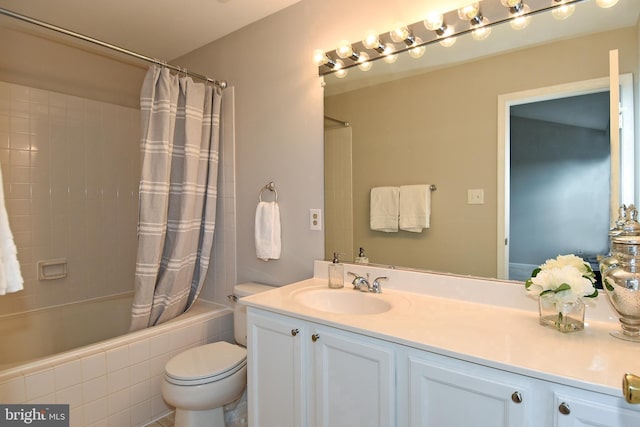 full bathroom featuring vanity, toilet, and shower / bath combo with shower curtain