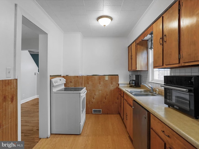 kitchen with white range with electric stovetop, sink, ornamental molding, stainless steel dishwasher, and light wood-type flooring