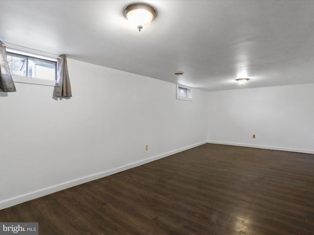 basement with dark wood-type flooring