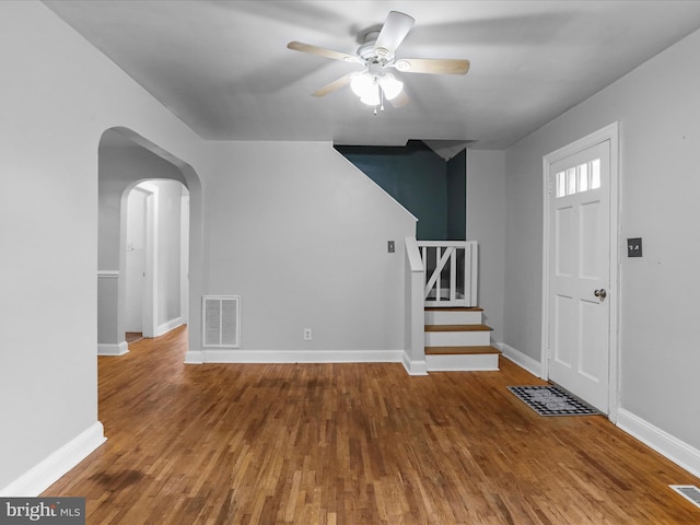 foyer entrance featuring ceiling fan and wood-type flooring