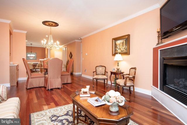 living room featuring an inviting chandelier, ornamental molding, and dark hardwood / wood-style flooring